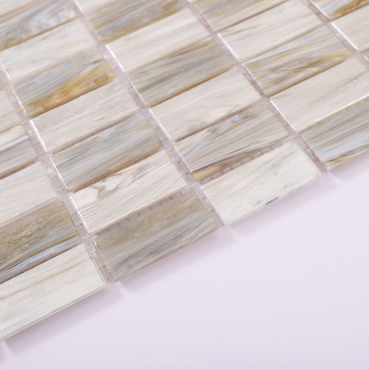 Side view showing tile thickness of beige and gray checkered mosaic tile