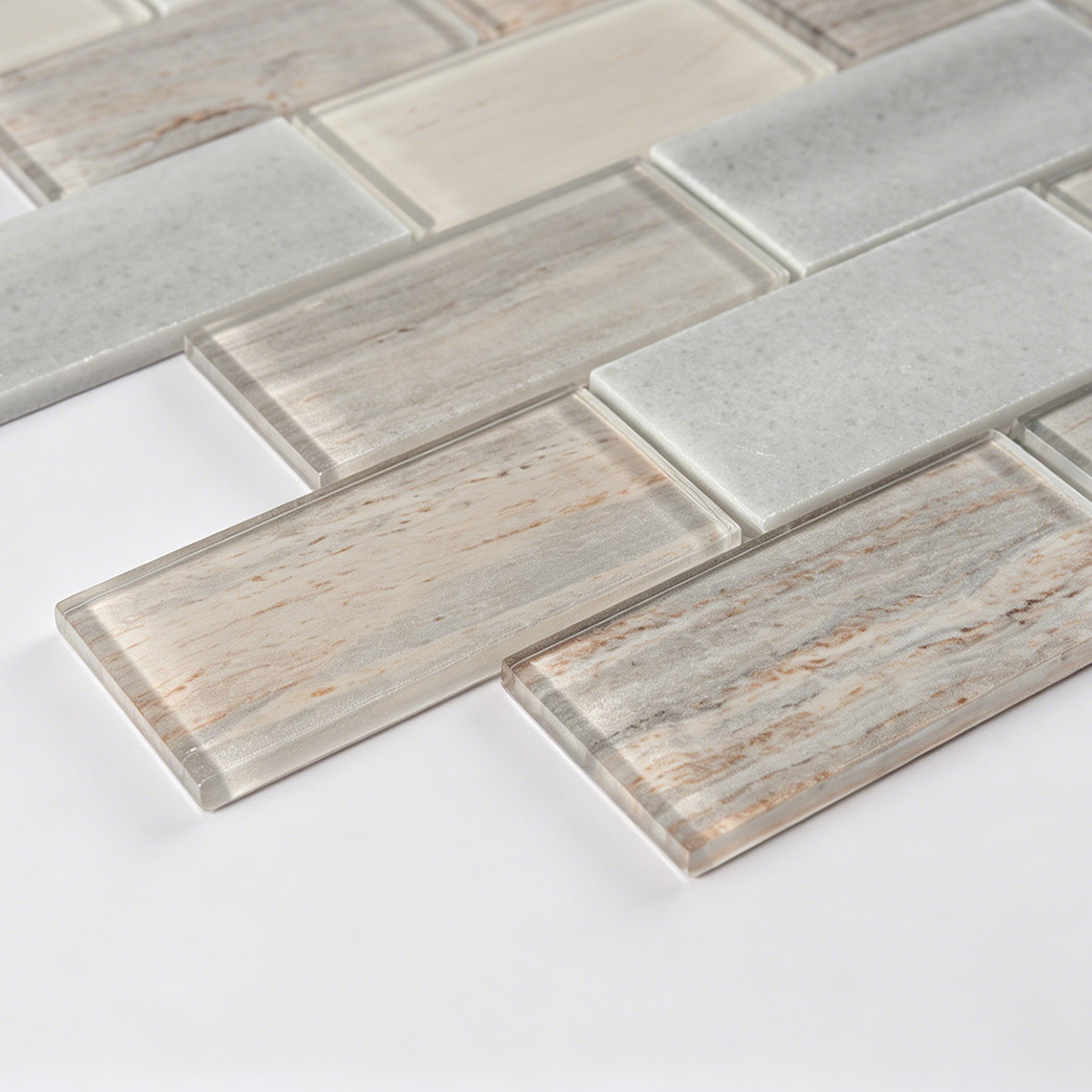 Close up of beige gray subway mosaic with beveled glass and stone pieces