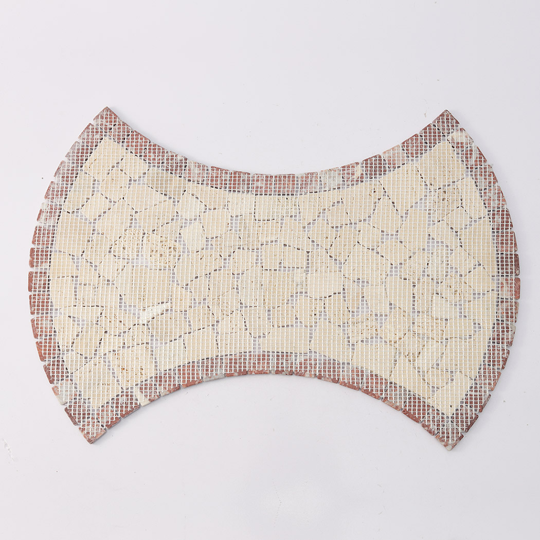Back view of beige irregular marble pebble mosaic tile with red border and mesh backing