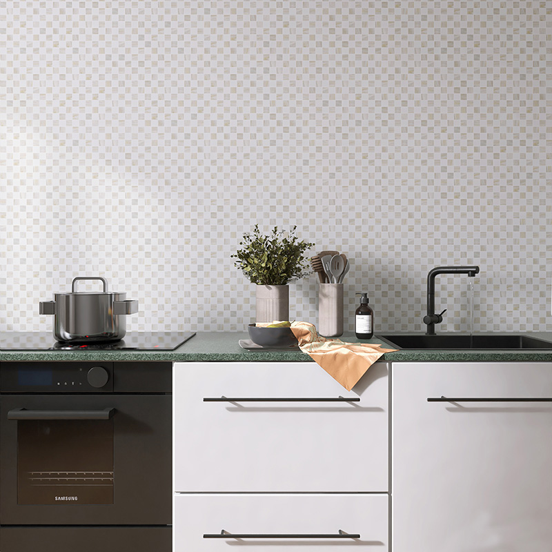 Beige kitchen tiles backsplash behind modern white cabinets and black fixtures
