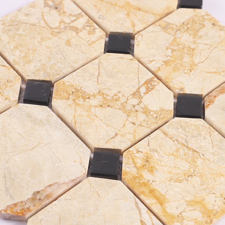 Angled view of beige octagon marble mosaic with black square accents