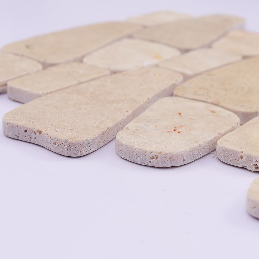 Side view showing thickness of beige pebble mosaic tiles