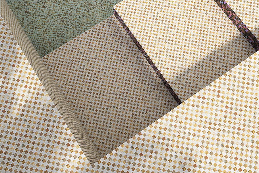 Beige pool tiles micro-mosaic pattern on pool steps, sunlit spa surround