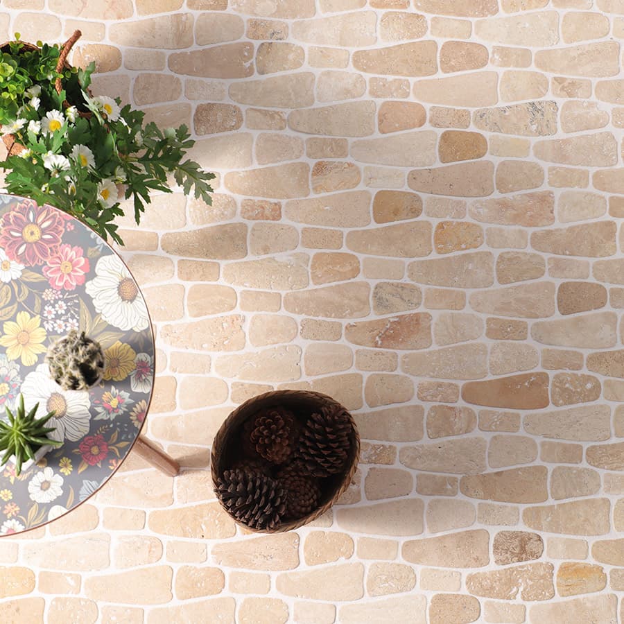 Top view of beige stone mosaic tiles with floral table and basket