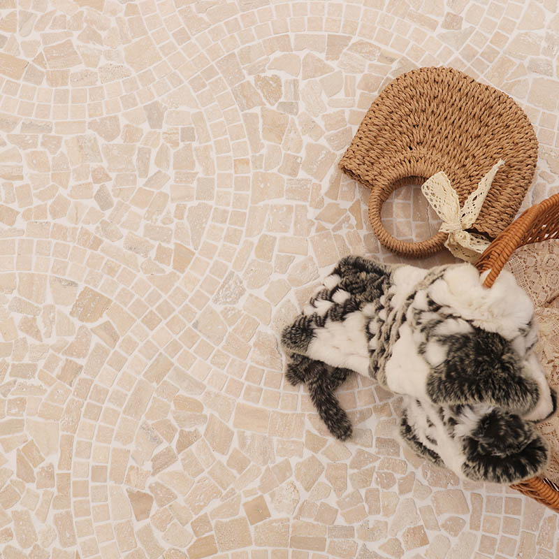 Beige travertine mosaic floor with basket and woven fan decor