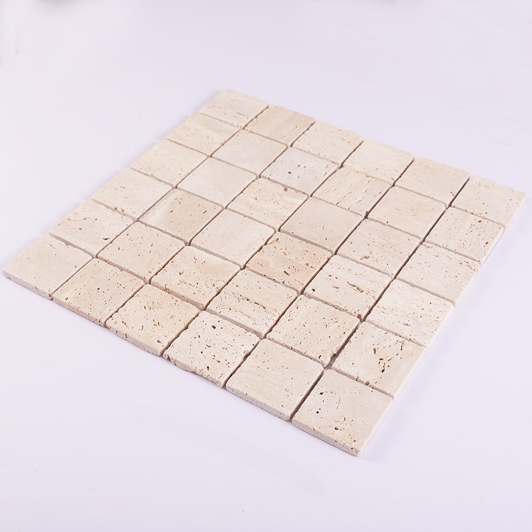 Angled perspective of beige travertine square mosaic tile sheet.