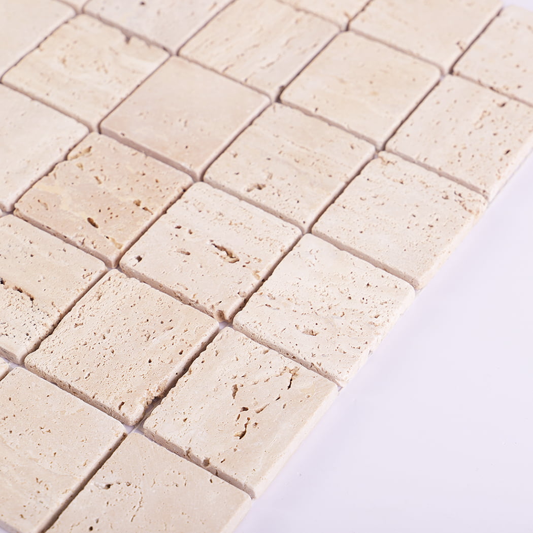 Side view of beige travertine mosaic tile showing tile thickness.