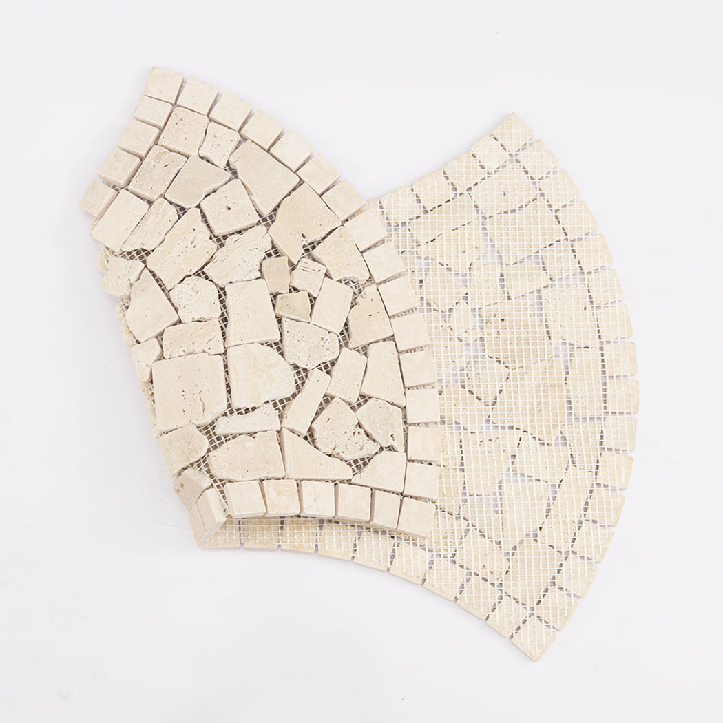 Back view showing the flexible mesh backing of a beige travertine pebble mosaic sheet.