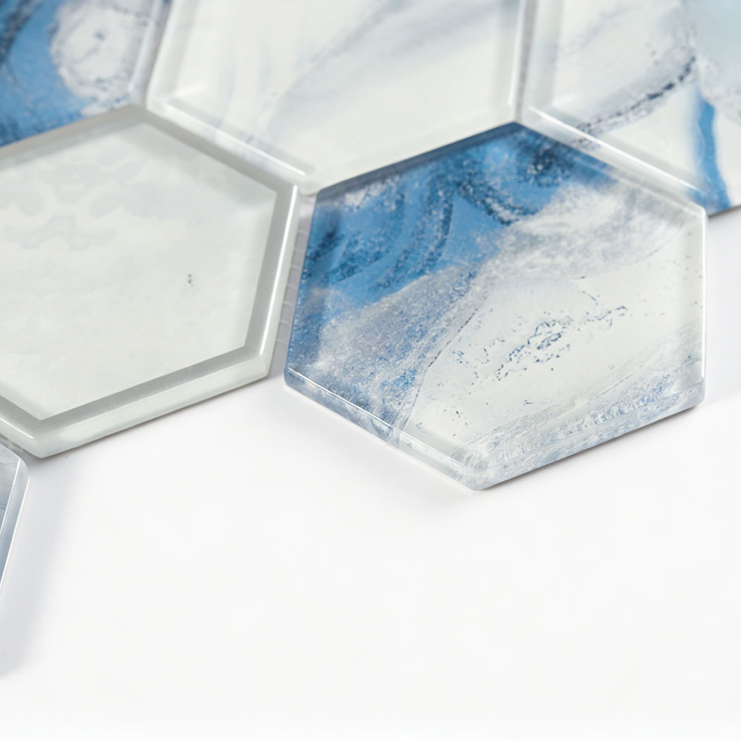 Beveled blue white hexagon glass tile with clear edge and soft cloudy pattern