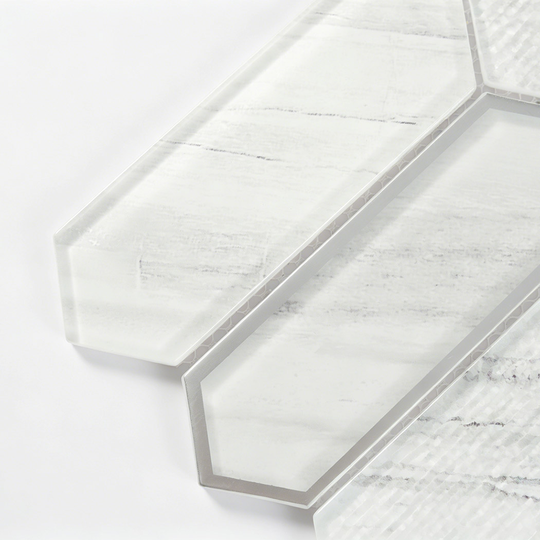 Beveled white marble look picket glass tiles with gray veining and silver edging