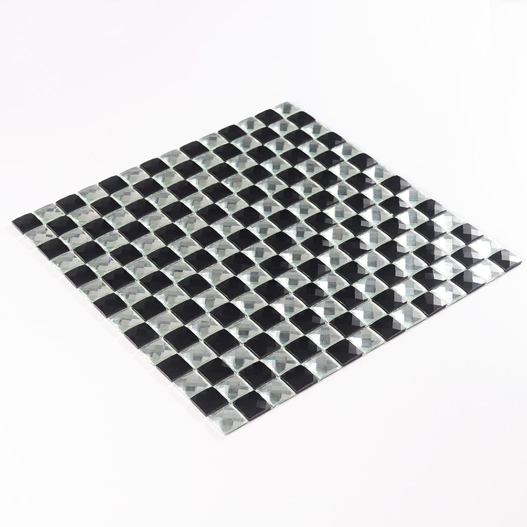 A full sheet of black and silver square mirror mosaic tile viewed from a tilted angle.