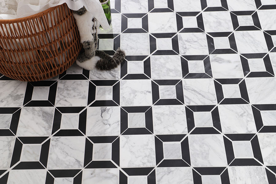Black and white geometric marble floor tile with square pattern in a room scene