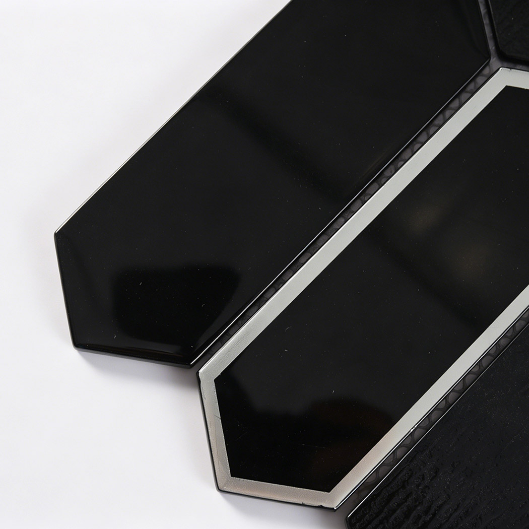 Close up of black beveled picket glass tile with silver glass frame
