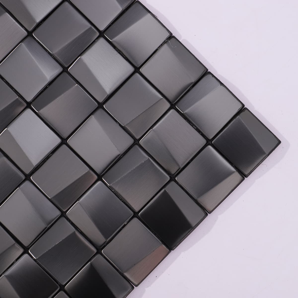 Textured surface of brushed black stainless steel cube tile