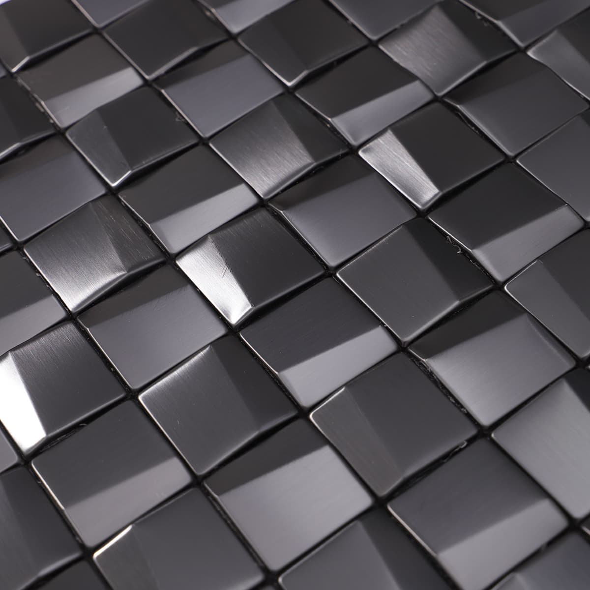 Corner close-up of 3D brushed black cube metal mosaic