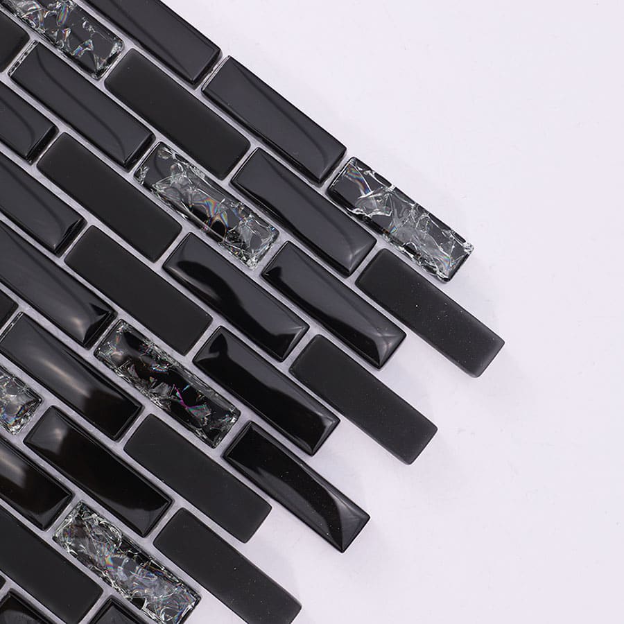 Close up of black glass and crackle crystal mosaic brick tile at an angle