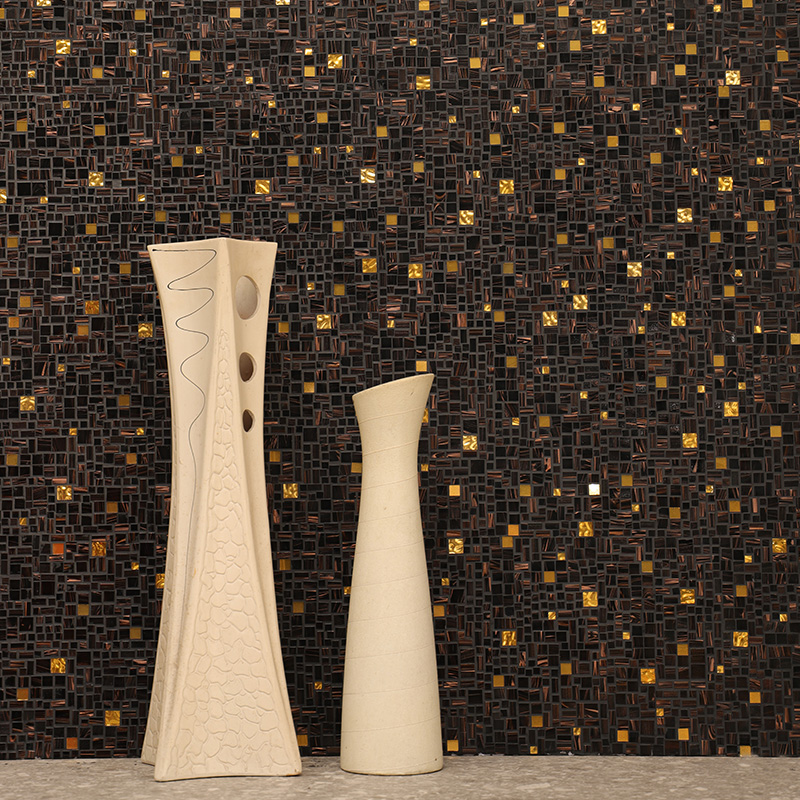 Black and gold glass mosaic tile backsplash with elegant modern wall design.
