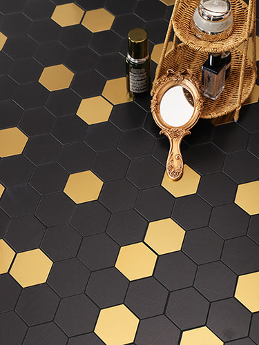 A chic black and gold hexagonal tile pattern, ideal for creating a luxurious, modern space.