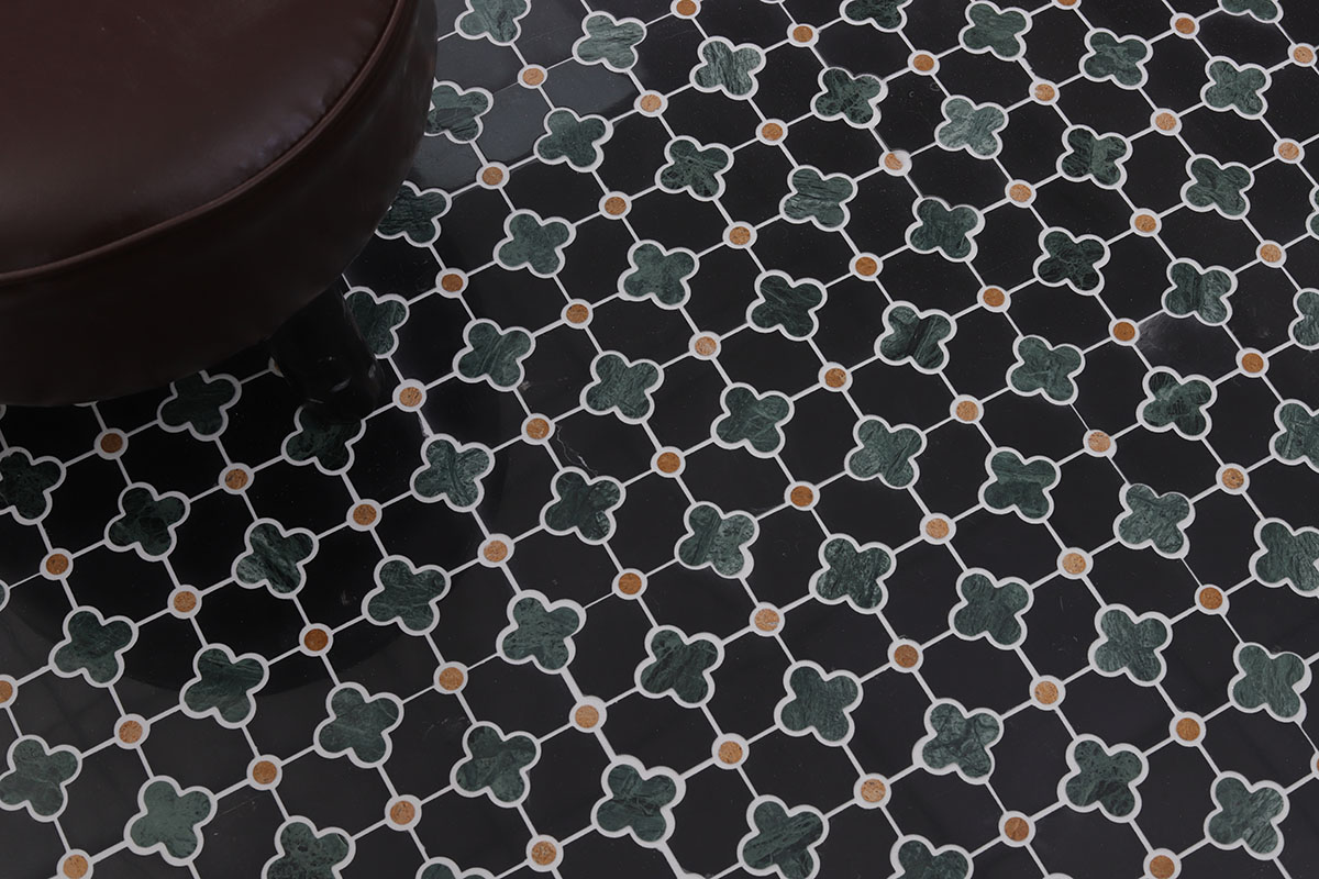 Black and green four-leaf clover mosaic floor tile with gold dots