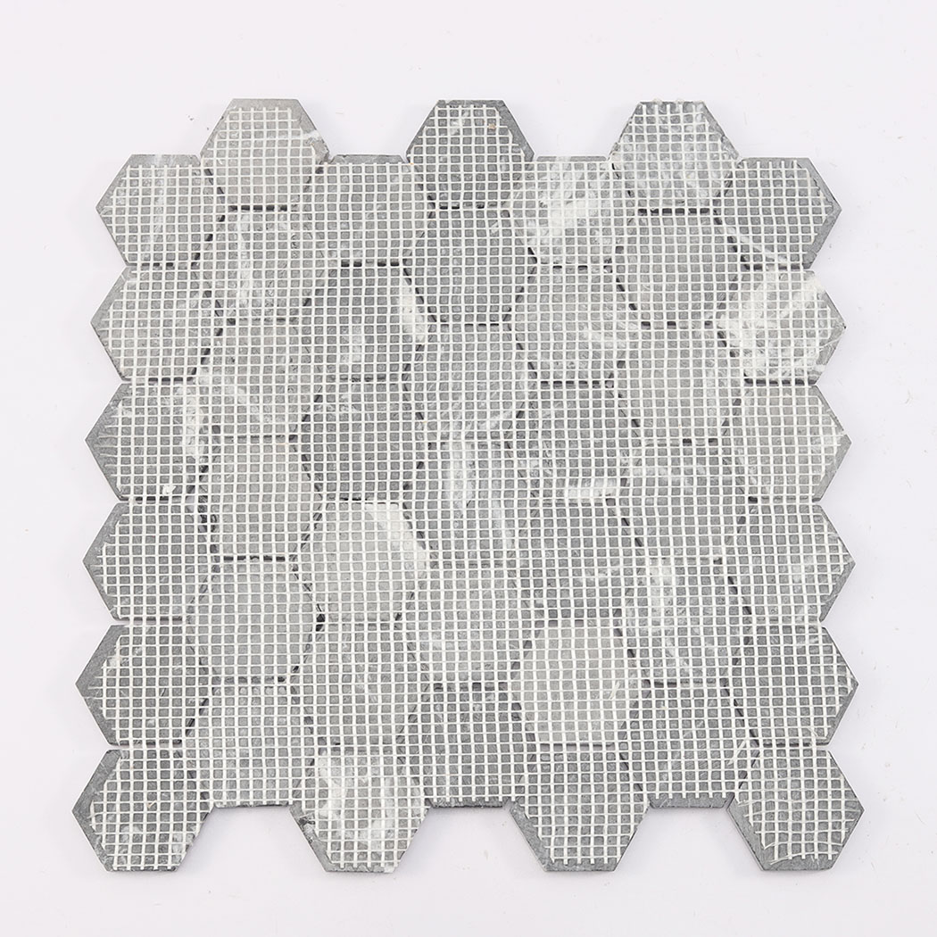 Back view of black hexagon marble mosaic tile with mesh backing