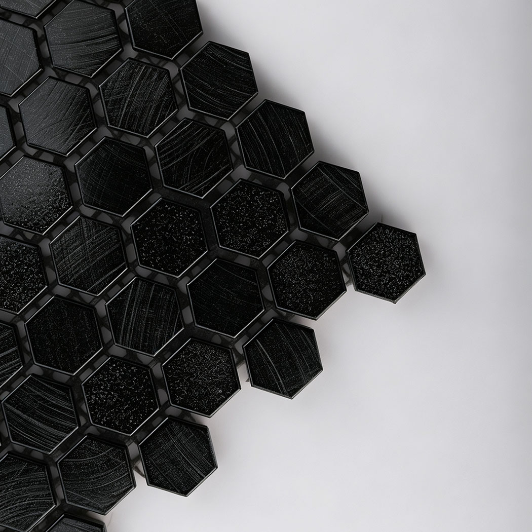 Corner macro shot of black hexagon tile with brushed texture