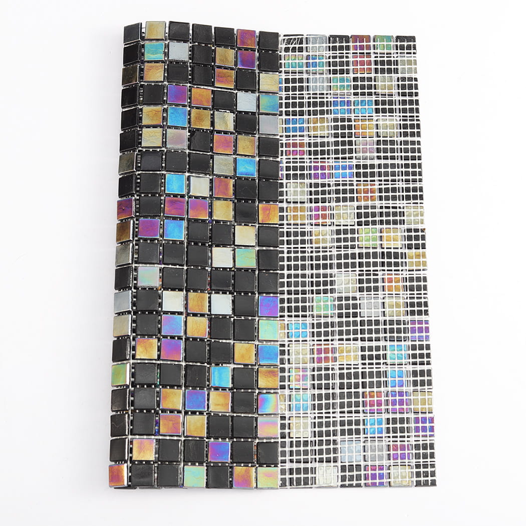 Black iridescent glass mosaic tile shown with mesh backing for installation