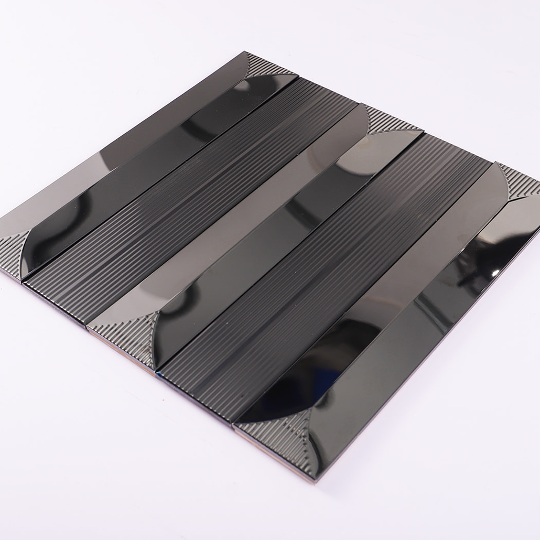 Angled perspective of glossy black metallic strip mosaic tile sheet.