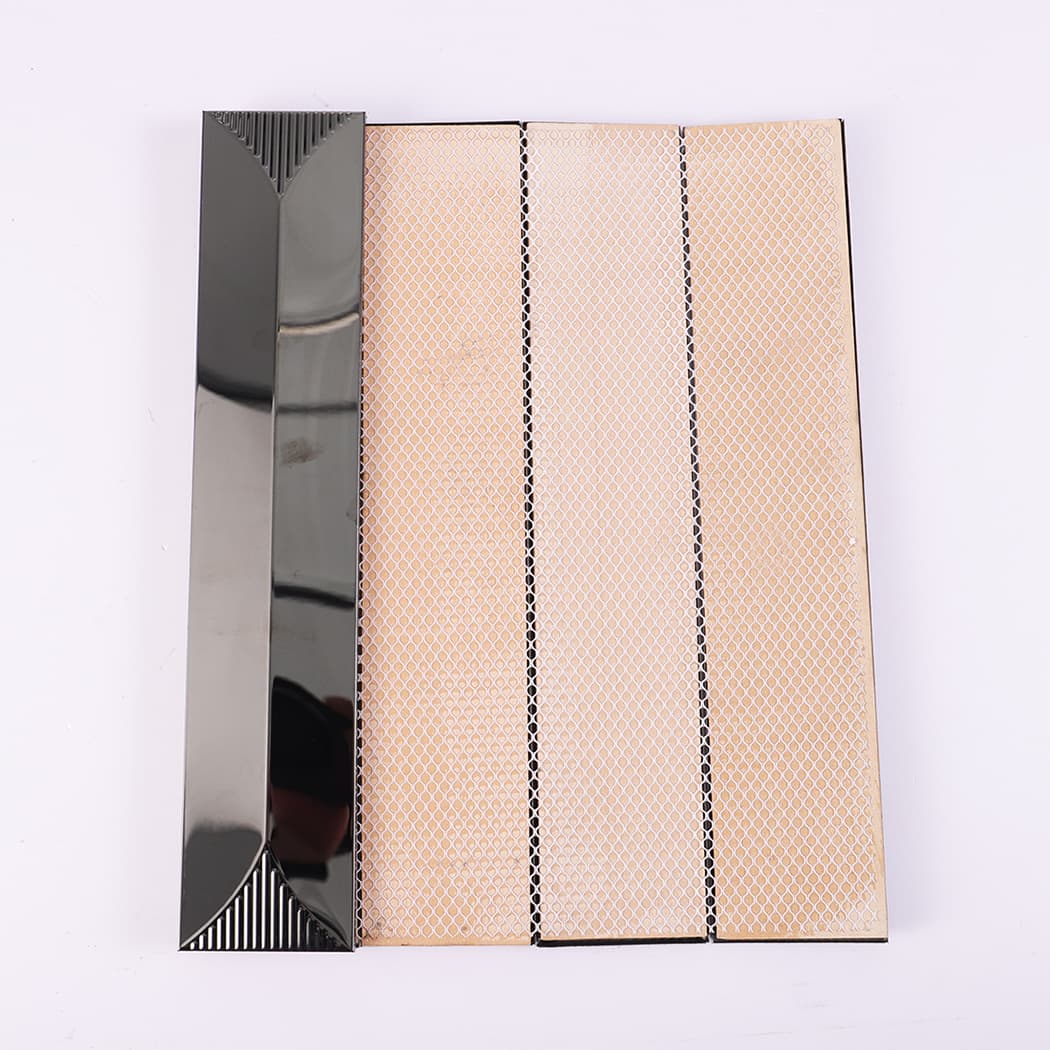 Back view showing mesh backing of black metallic strip mosaic tile.