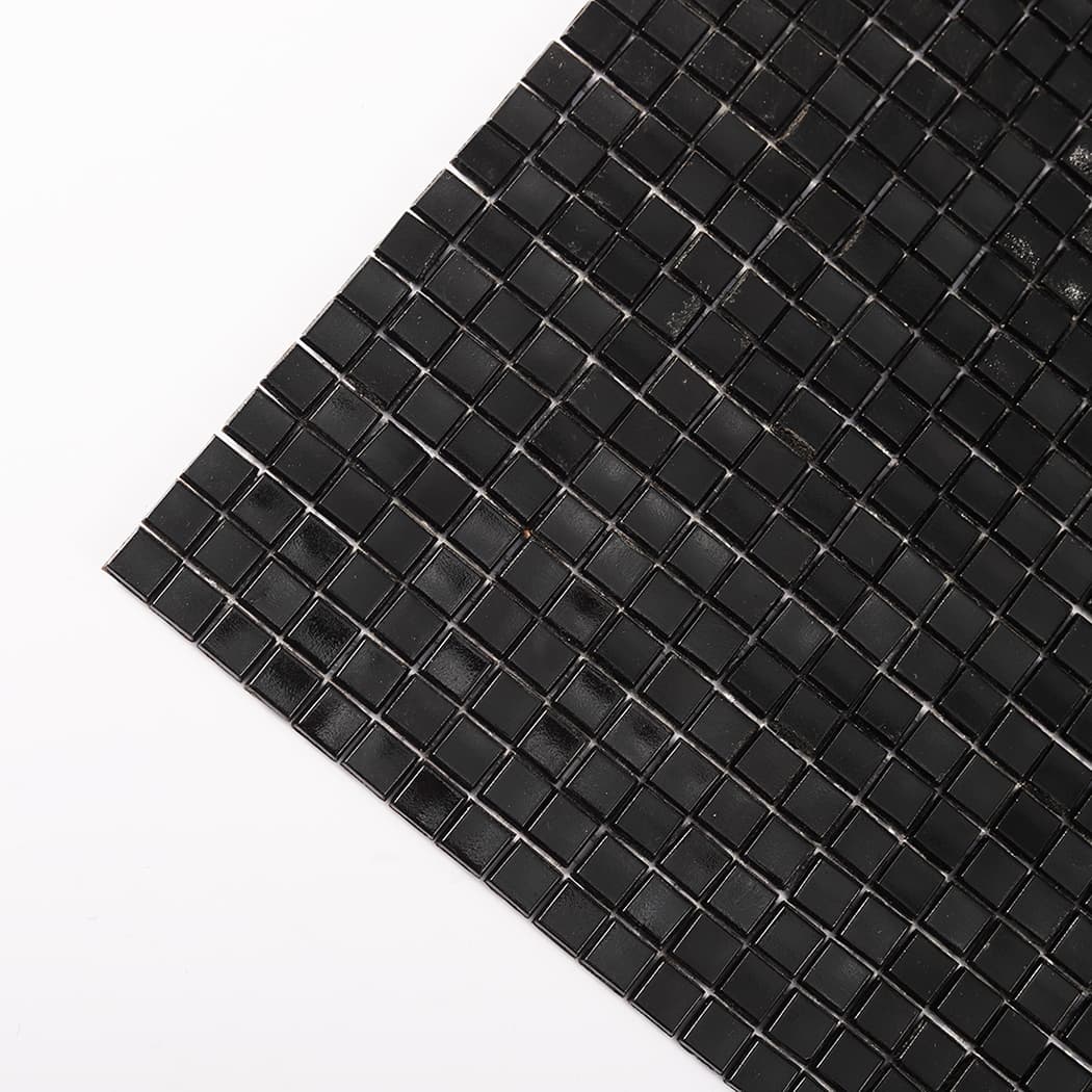 Diagonal corner close-up of black mini glass mosaic tiles