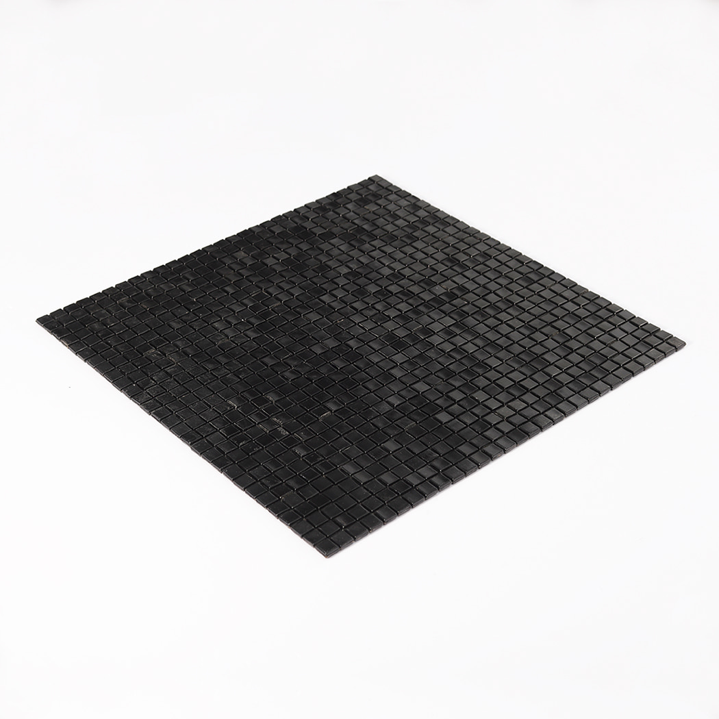 Angled view of full black mini glass mosaic tile sheet