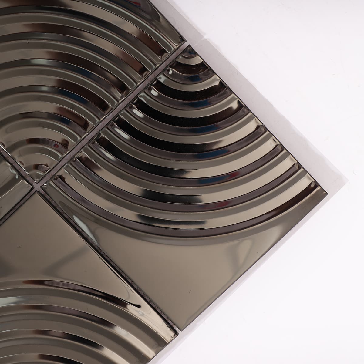 Close-up of black mirror metal arc mosaic tiles