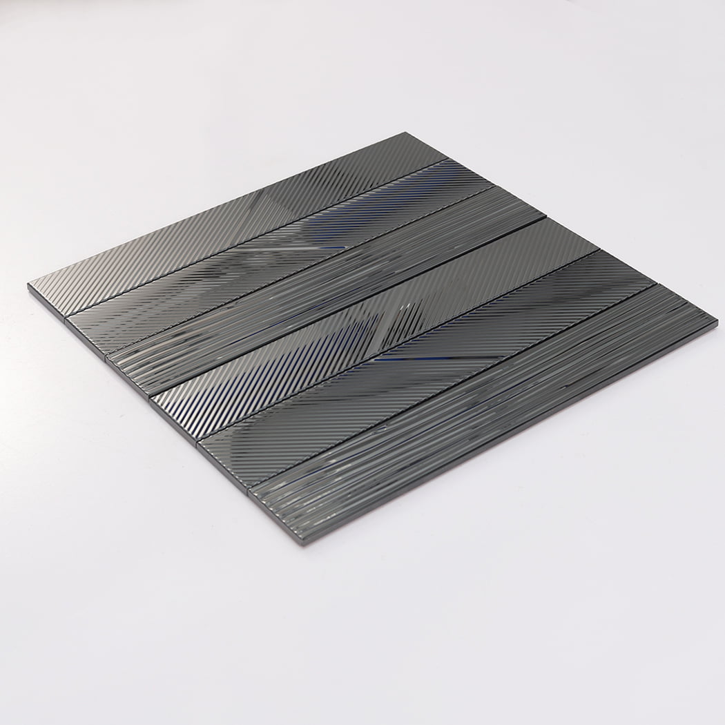 Angled view of black mirror stainless steel tile sheet with glossy grooved surface