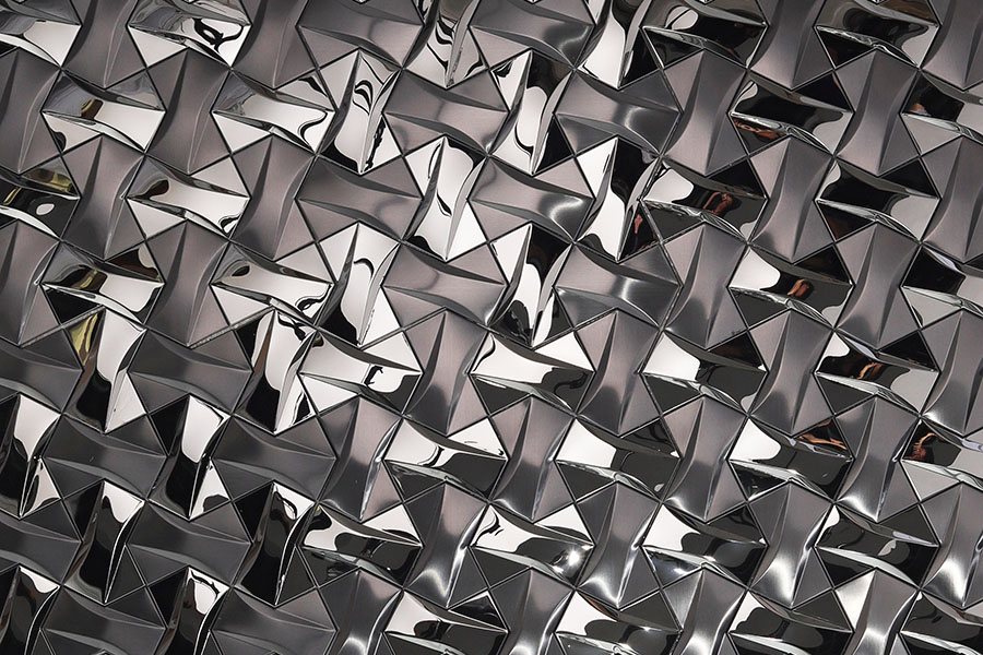 Black mirror trapezoid metal mosaic tile with faceted 3D geometric texture
