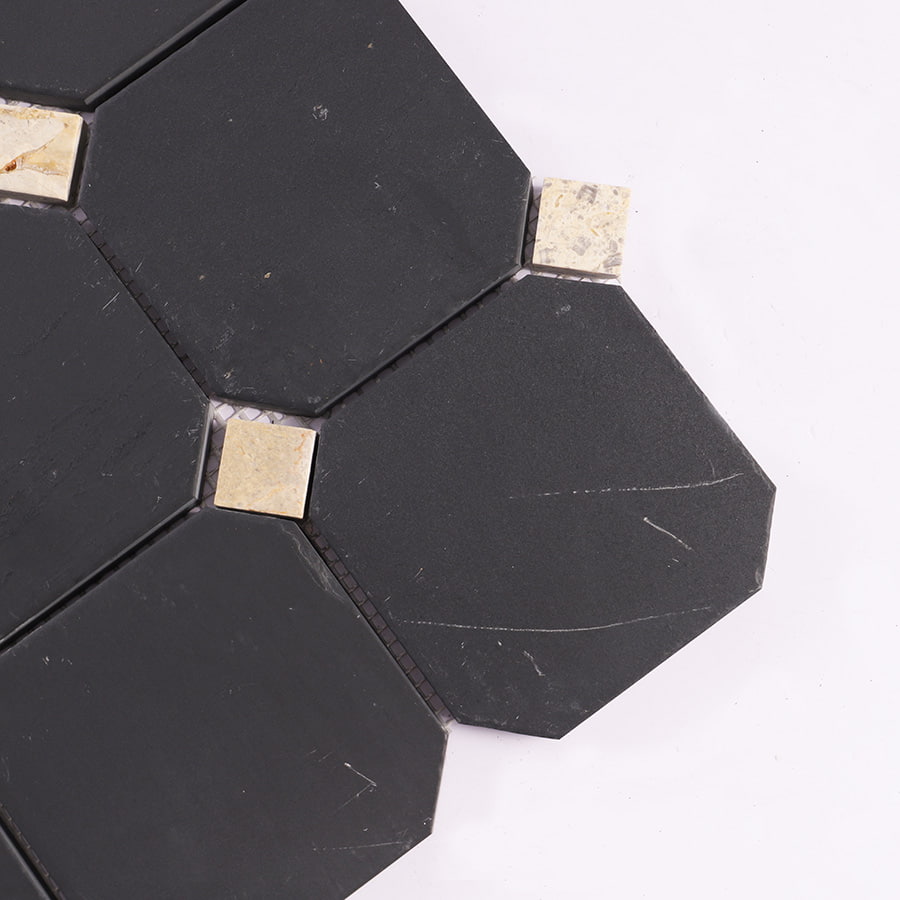 Close-up of black octagon marble mosaic with beige square accents