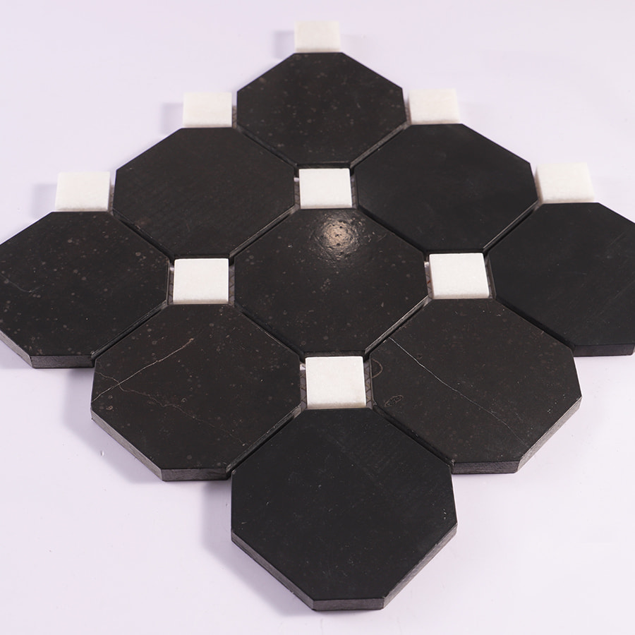 Angled view of black octagon marble mosaic with white square accents