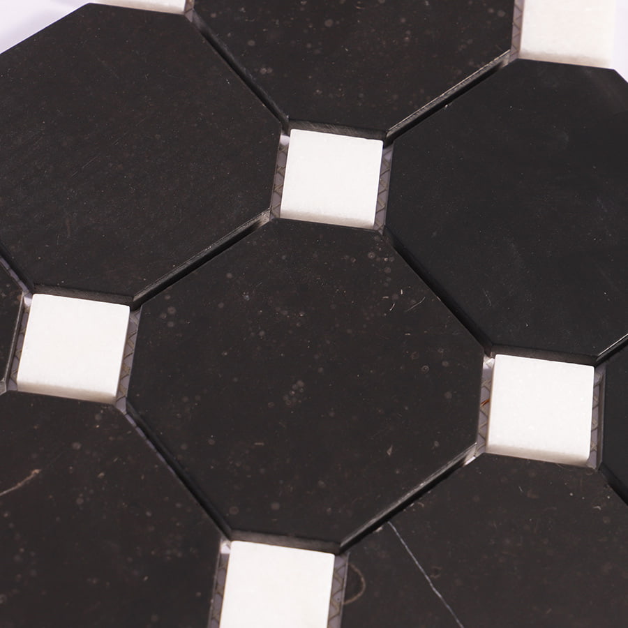 Close-up of black octagon marble mosaic with white square accents