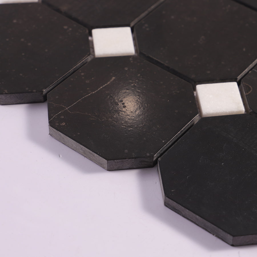 Edge view of black octagon marble mosaic with white square accents