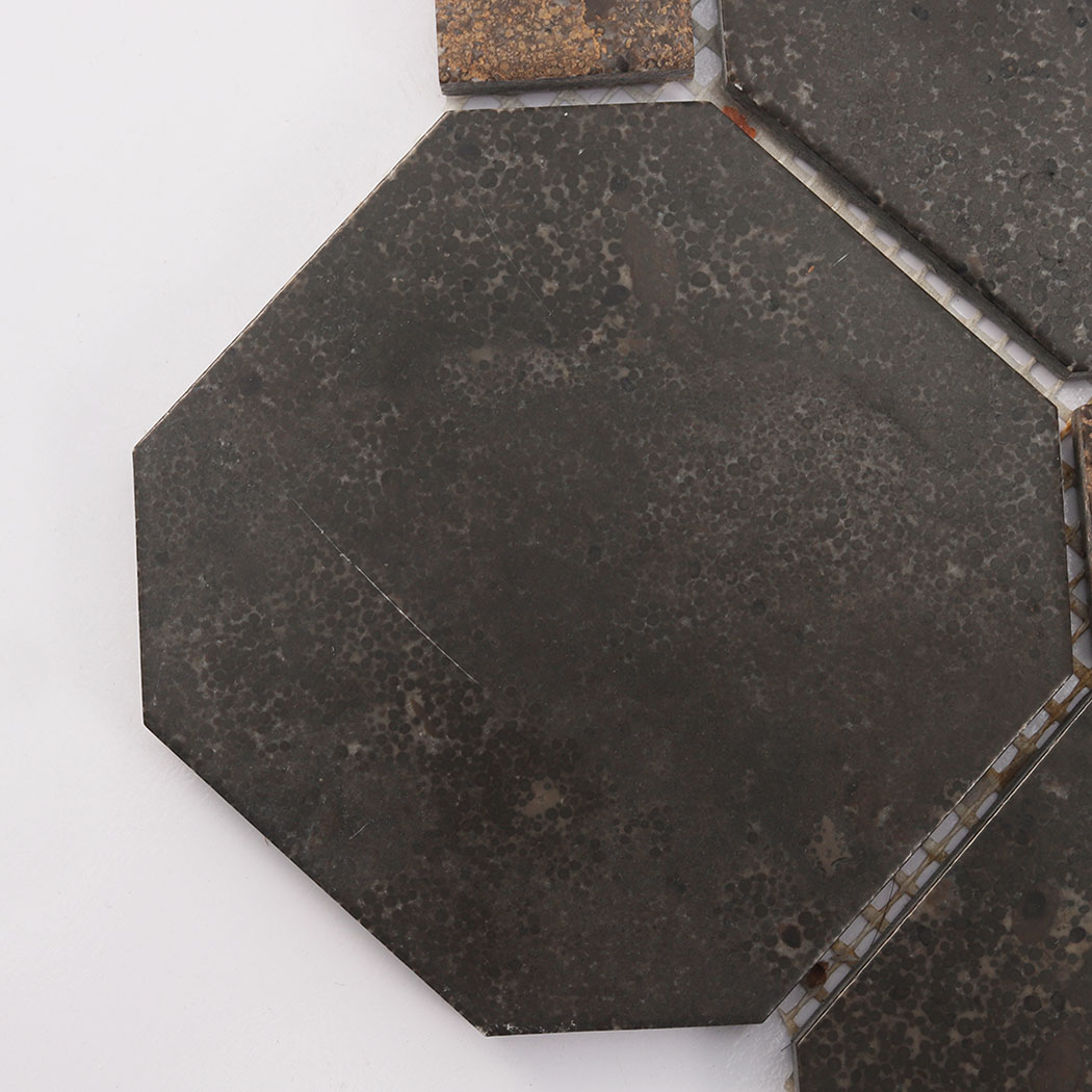 Close-up of dark brown octagon mosaic tile with natural speckled texture