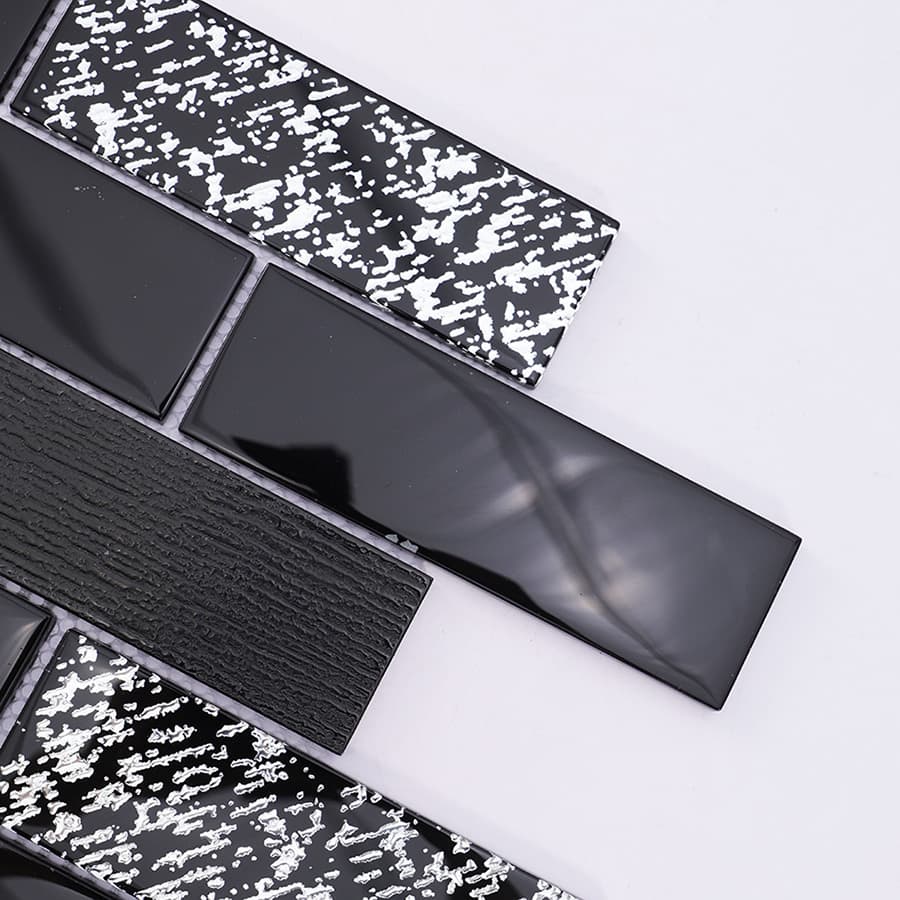 Close up of glossy black and silver subway glass mosaic tile texture
