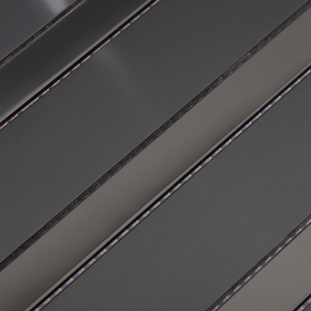 Brushed black stainless steel linear subway wall tile texture close-up
