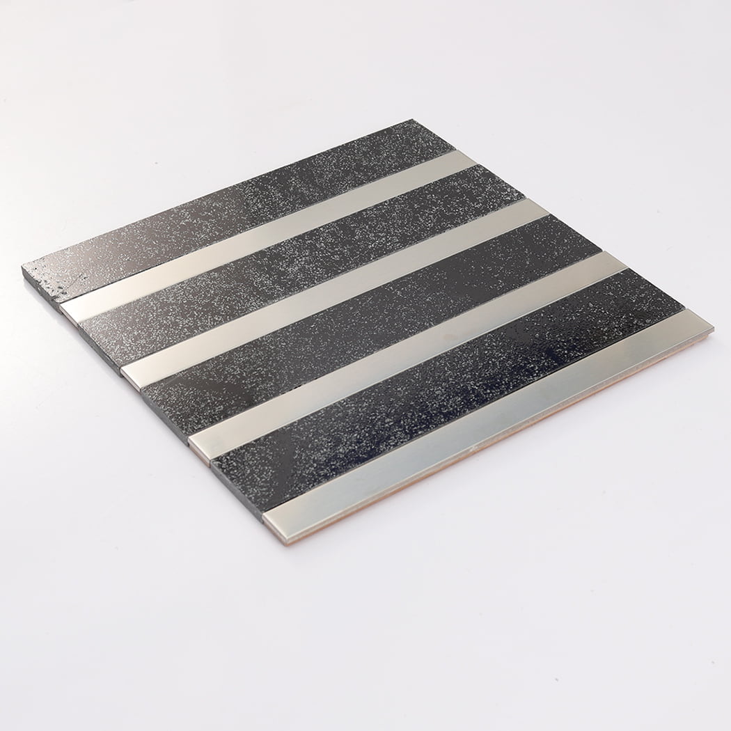 Low-angle view of black electroplated stone tile sheet with silver steel strips