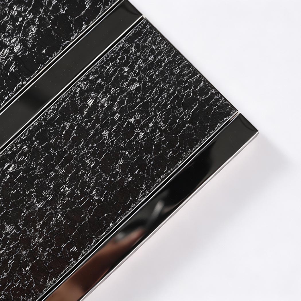 Close-up of glitter tiles and metal mosaic tiles for a black tile bathroom