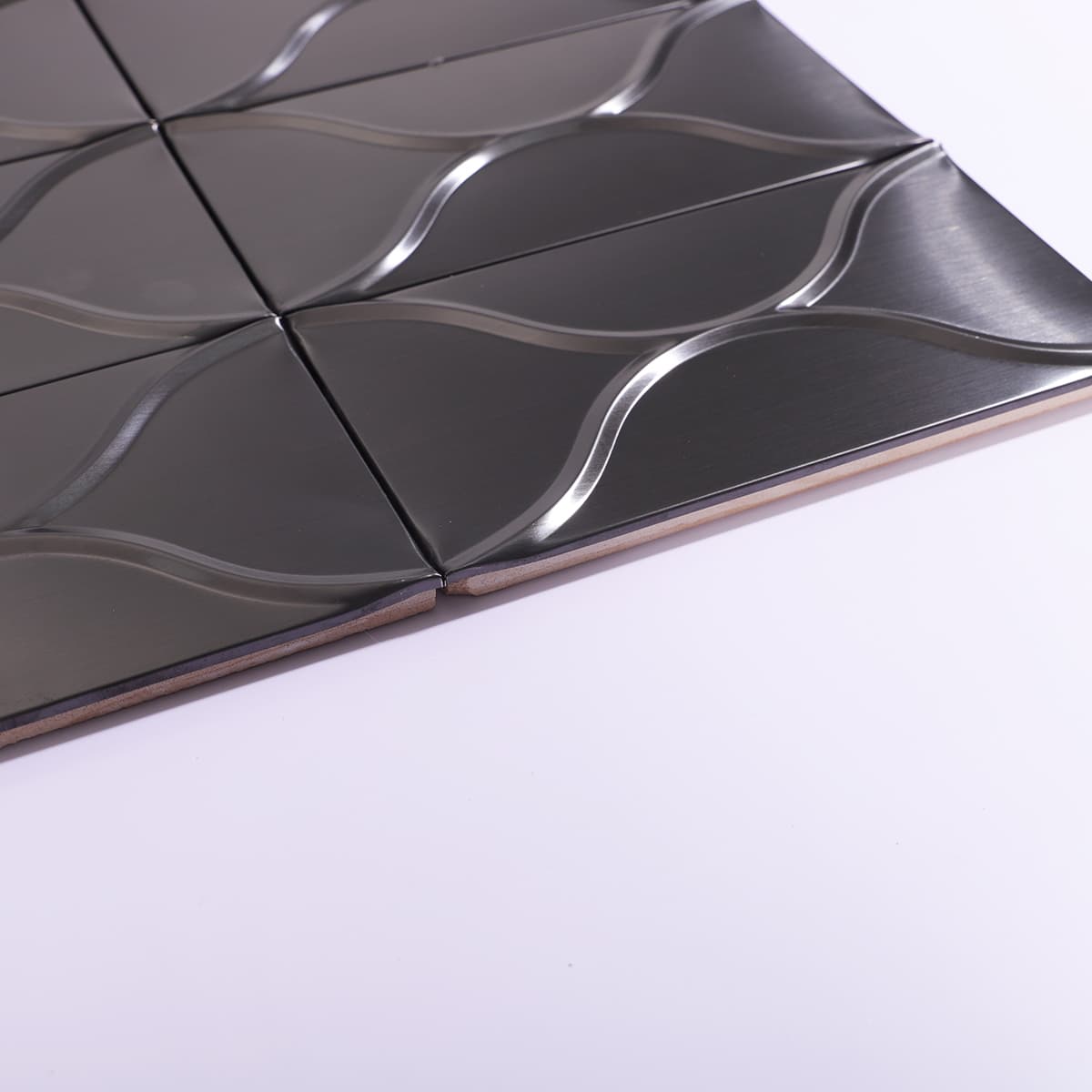 Side angle showing thickness of curved stainless mosaic