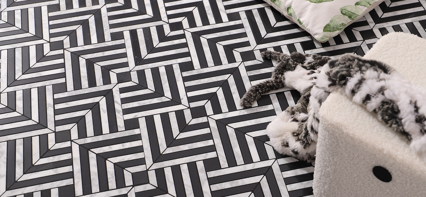 Wide view of 3D black and white marble tile with striped cube pattern