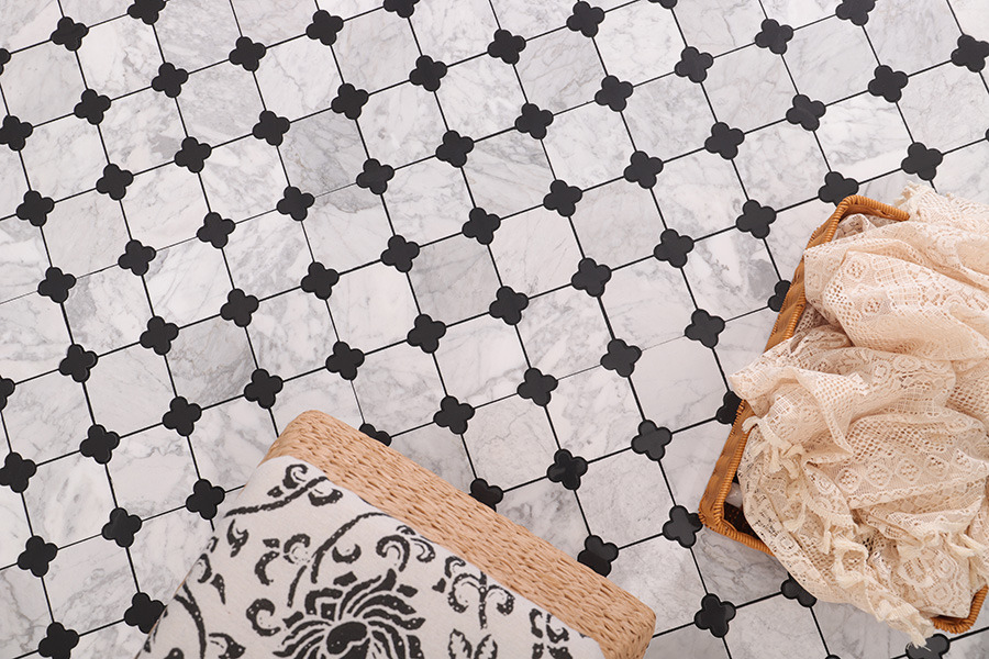 Black and white clover marble mosaic floor tiles in a styled interior setting