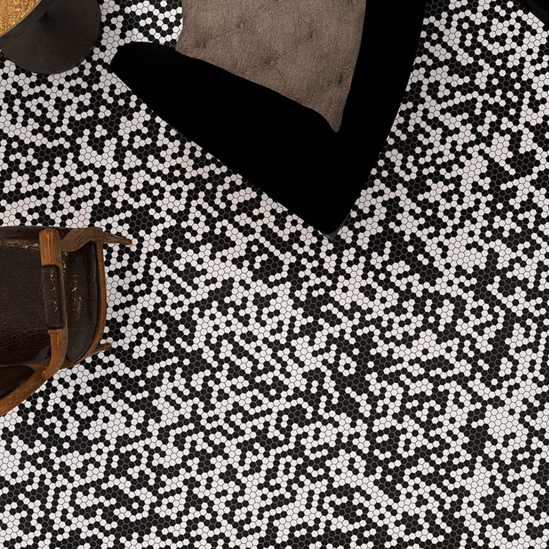 Close-up of black and white hexagon mosaic tile with digital pixel-style design