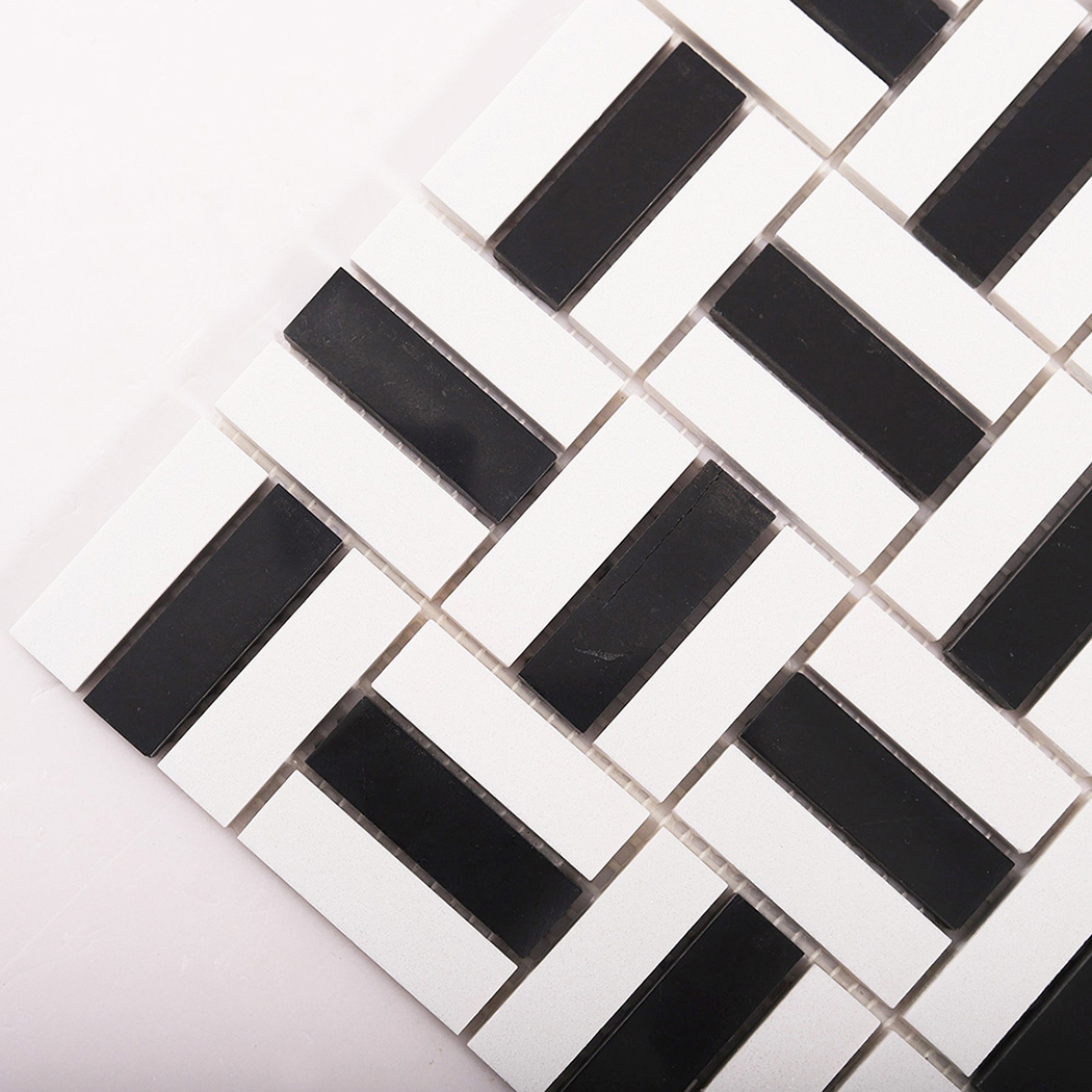 Corner detail of black and white mosaic tile sheet on white background