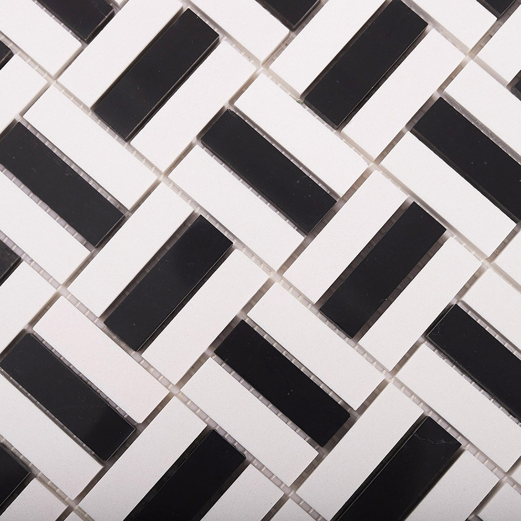 Diagonal close-up of black and white mosaic tile layout