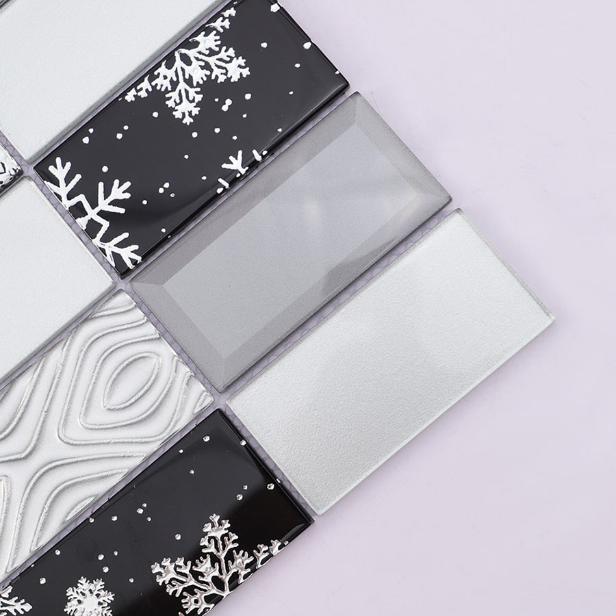 Close up of corner detail showing snowflake pattern on glass mosaic tile