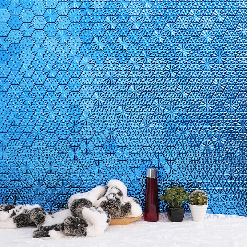 Blue 3D hexagon mosaic tile feature wall with decorative items on ledge